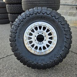 17" KMC rims w/ 35x12.50R17 Toyo MT Open Country