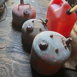 3 Metal Gas Cans And 1 Plastic 