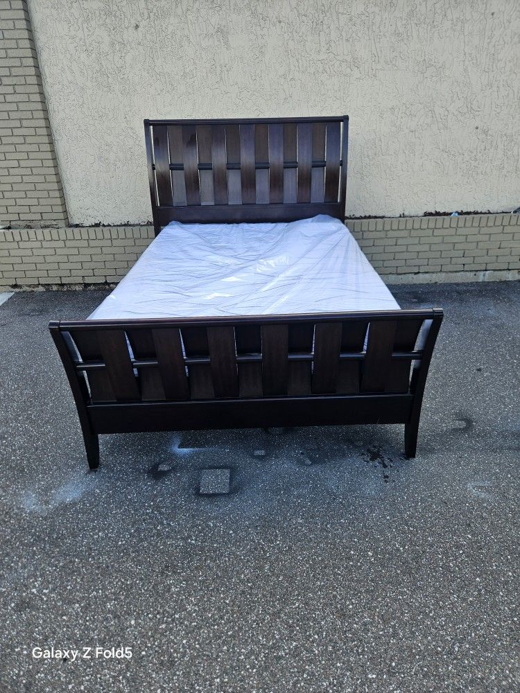 Brown Queen Size Sleigh Bed Frame With Brand New Queen Size Plush Memory Foam Serta Mattress And Box Spring In Plastic