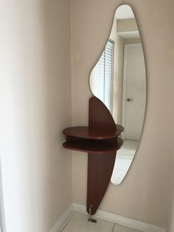 New   Luxury Italian entrance console table with mirror. Mirror has a custom shape. Solid wood table color: Brown Cherry. H80”X W26”. Made In Italy .