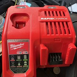 Milwaukee Rapid Charger , Impact Driver And Batteries 