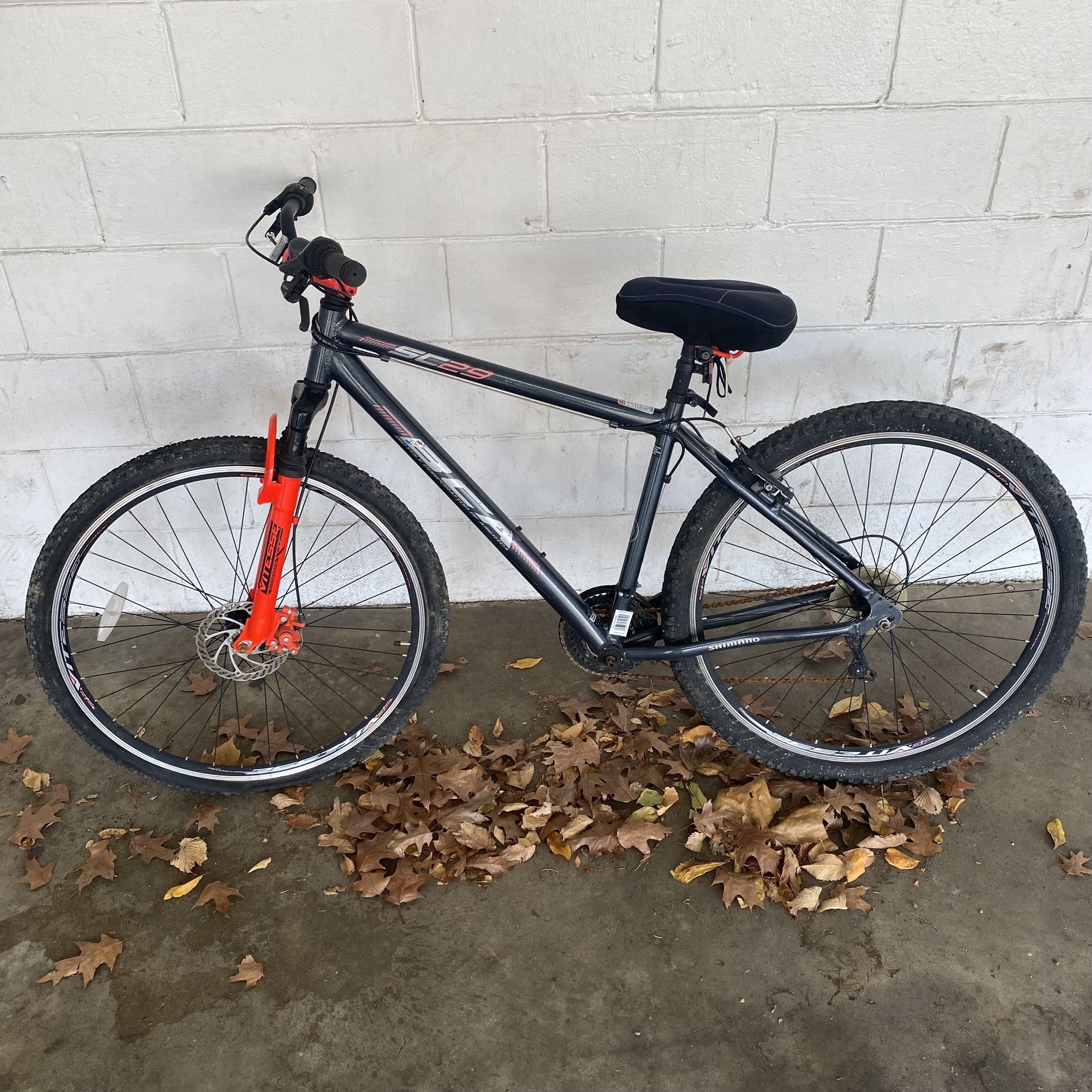 BCA (Bicycle Corporation of America) Black and Orange SC-29 29” Mountain Bike Bicycle Good pre-owned condition. The entire right pedal section is mi