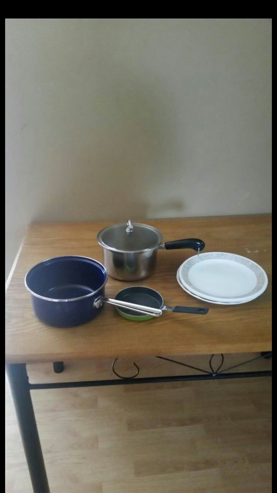 Kitchen pots, pan, and plates.