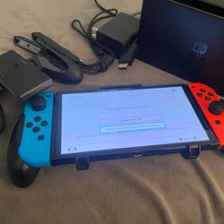 Nintendo Switch OLED console bundle + 9 Games 