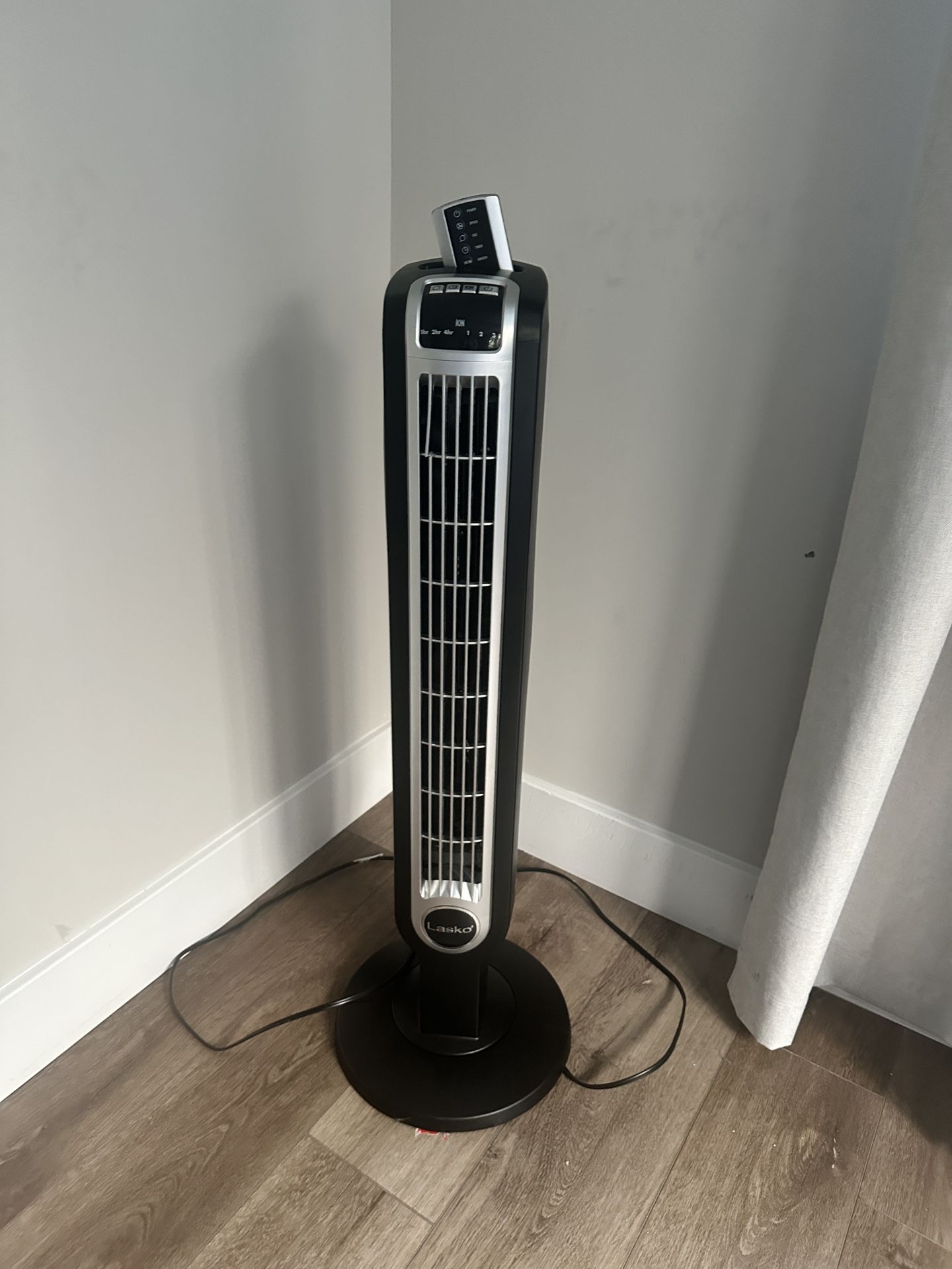 2 Lasko Oscillating Tower Fans with Remote Controls for $55