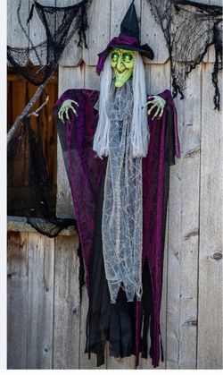 4 Ft. Hanging Animated Witch with Green Eyes Halloween Decoration