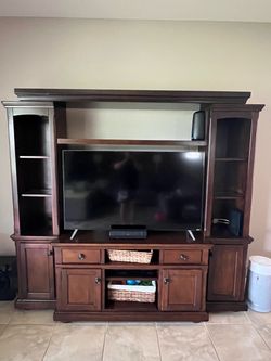 Ashley Furniture Entertainment Center with Hutch and Side Piers