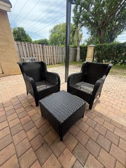Two backyard chairs and a table