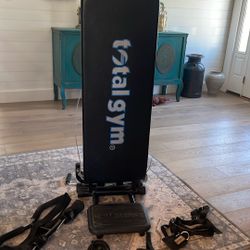 Chuck Norris total gym includes bars and ankle weights