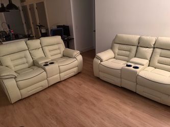 Cream reclining loveseat