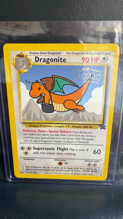 1999 Pokémon "Kids WB Presents Pokémon: The First Movie" promo card featuring Dragonite (#5).