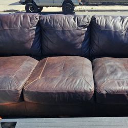 Nice comfy Leather foe Couch in Brown color by Ashley Furniture. Can Deliver $$