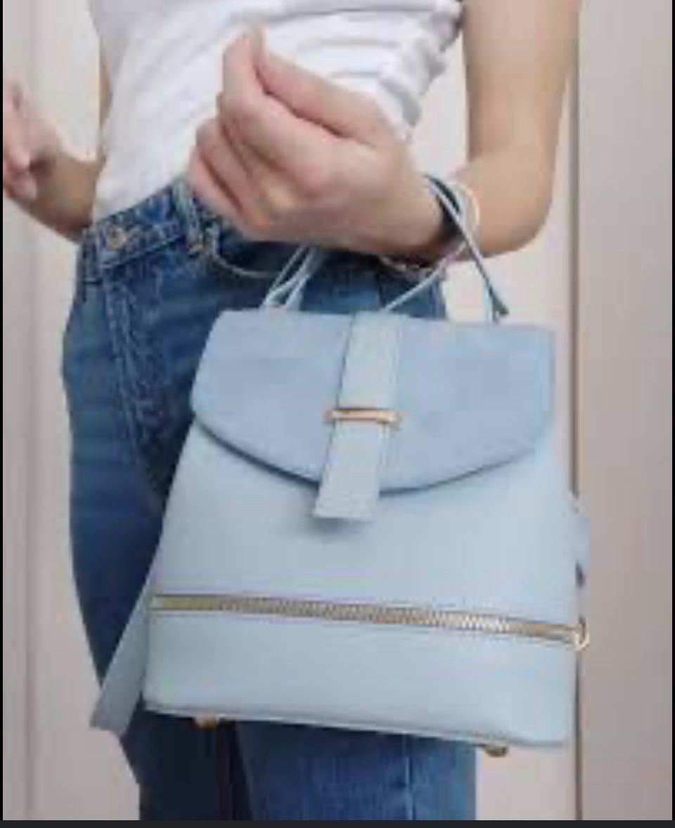 This is a light blue top-handle handbag, also known as a satchel bag or crossbody bag, made of PU