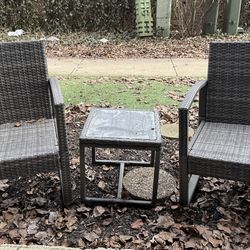 Two outdoor chairs with table