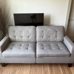 Gray Tufted loveseat 