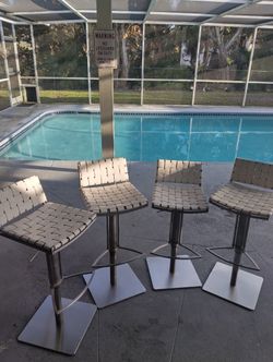 (4) FLOYD GAS LIFT SWIVEL BARSTOOLS  -  MODERN BONDED  - LEATHER SEATS, ADJUSTABLE HEIGHT & 360 DEGREE COMFORT FUNCTIONALITY.