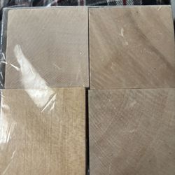Set of four wooden blocks, perfect for crafts or DIY projects. 