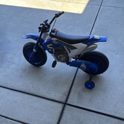 Kids ride on electric dirt bike  wth training wheels