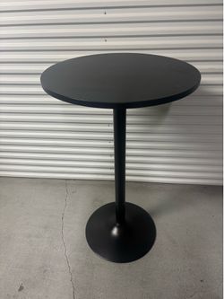 2 High top table with 4 chairs.