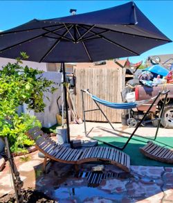 Blue umbrella, hammock, two beach chairs