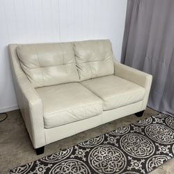 Off white leather loveseat couch