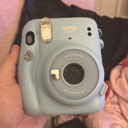 Blue insta mini 11 camera