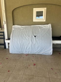 Queen size mattress and black bed frame