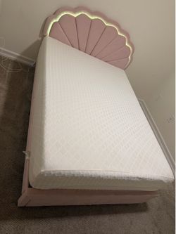 Full size bed frame and mattress.