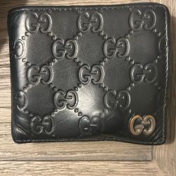 Authentic Gucci Black GG Embossed Leather Bifold Wallet – Used