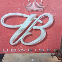 Metal Budweiser sign.
