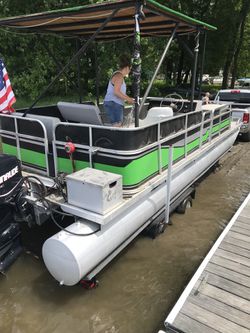 24 ft pontoon with 2013 90 hp 4 stroke etec