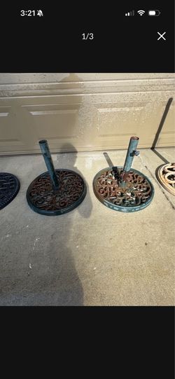 Cast iron ornate umbrella holders both for $100 or $60 each