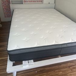 Wood Queen headboard and platform frame.  Matress included.
