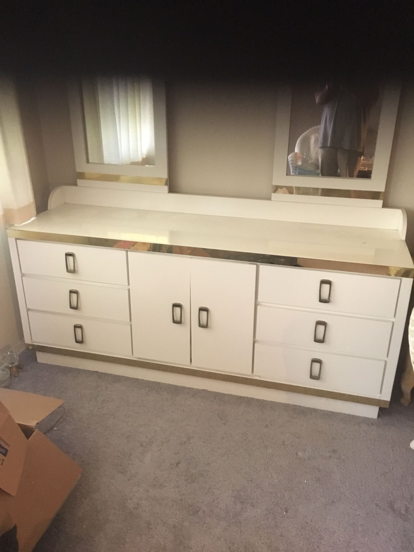 Nine drawer dresser, white with gold trim.