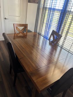 Wooden dining table and chairs
