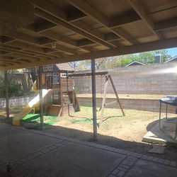 Kids out door play house and trampoline