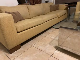 Large Beige Fabric Sofa bed with Wood Legs. Matching chair