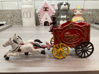 VINTAGE CAST IRON CIRCUS DRIVER WITH TWO HORSES