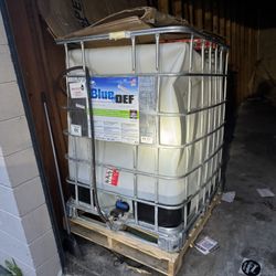 Large jug with blue Def In it