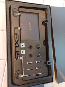 LEXUS  black license plate frame one piece. Black frame with Raised lettering. NEW