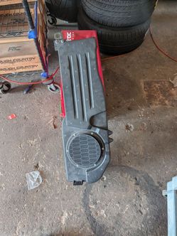 Chrysler/Mopar OEM factory rear subwoofer and speaker enclosure assembly.