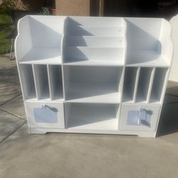 white wooden cubby storage unit for children