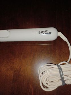 Conair curling iron. $3.