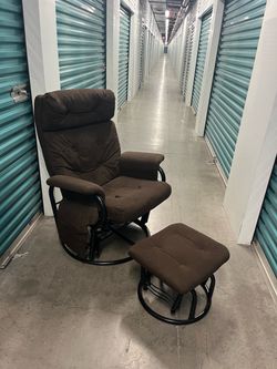 Cute and comfy brown chair and ottoman. Needs a little wipe down.