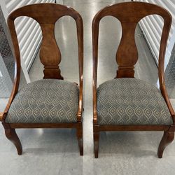 Pair Of Thomasville Upholstered dining room chairs. Used in good condition with some minor cosmetic blemishes. These blemishes are in the form of some