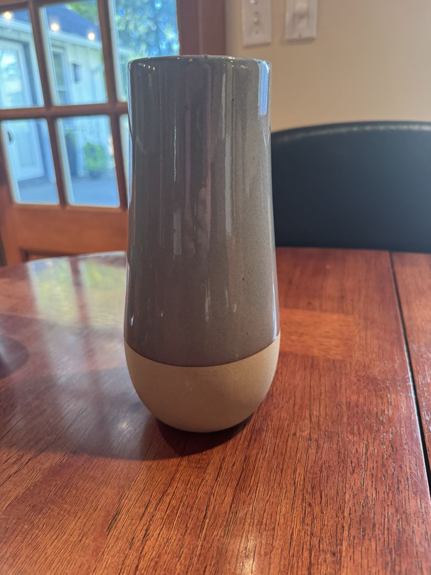 Beautiful ceramic two-toned vase. 9”T x 3.25D