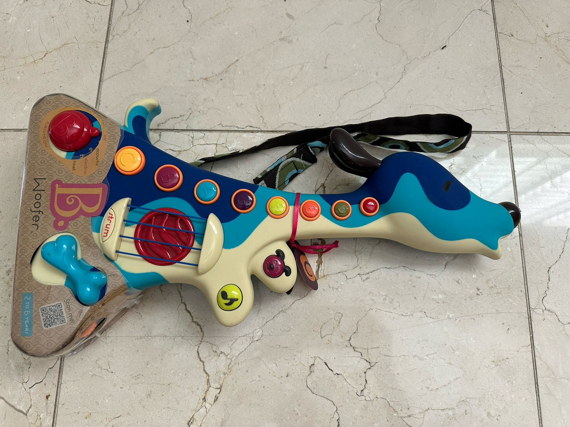 B. Woofer Dog Guitar Toy