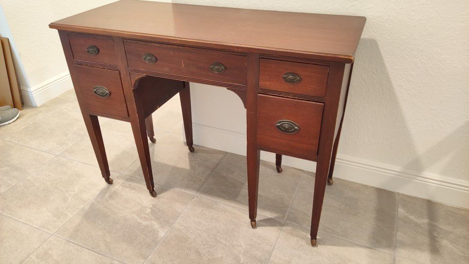 beautiful antique Continental Furniture Co. desk on casters