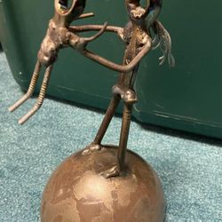 Miscellaneous vintage nuts and bolts bronze art piece.
