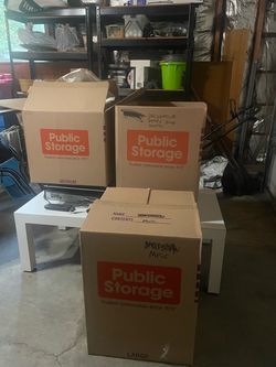 4 heavy duty moving boxes with some packing material.